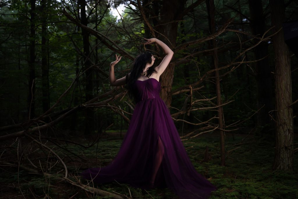 Moira in the woods, by Emily Winders